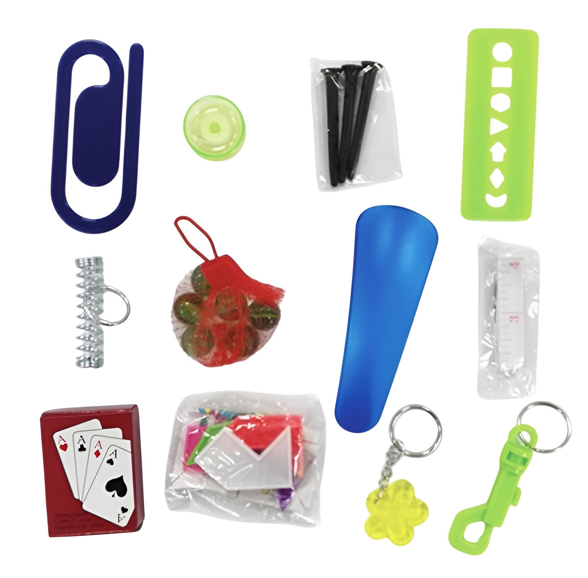 Assorted small items including a paper clip, ball, and keychains on a white background