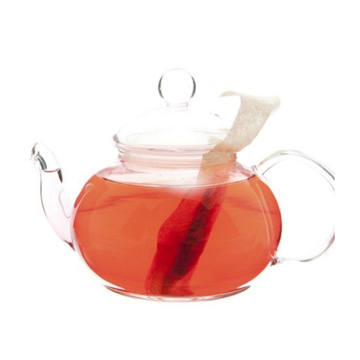 Glass teapot with a teabag and light red tea inside.