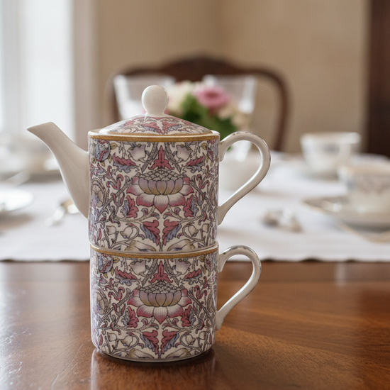 William Morris Lodden design teapot and mug stacked on a table.