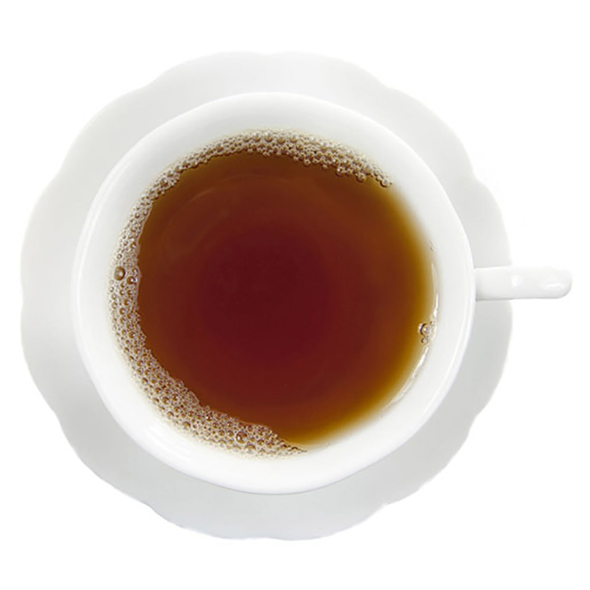 White cup filled with dark colored hot tea on a white background