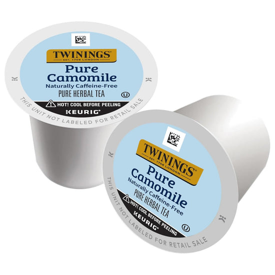 Two Twinings Pure Camomile tea K-Cup capsules on a white background