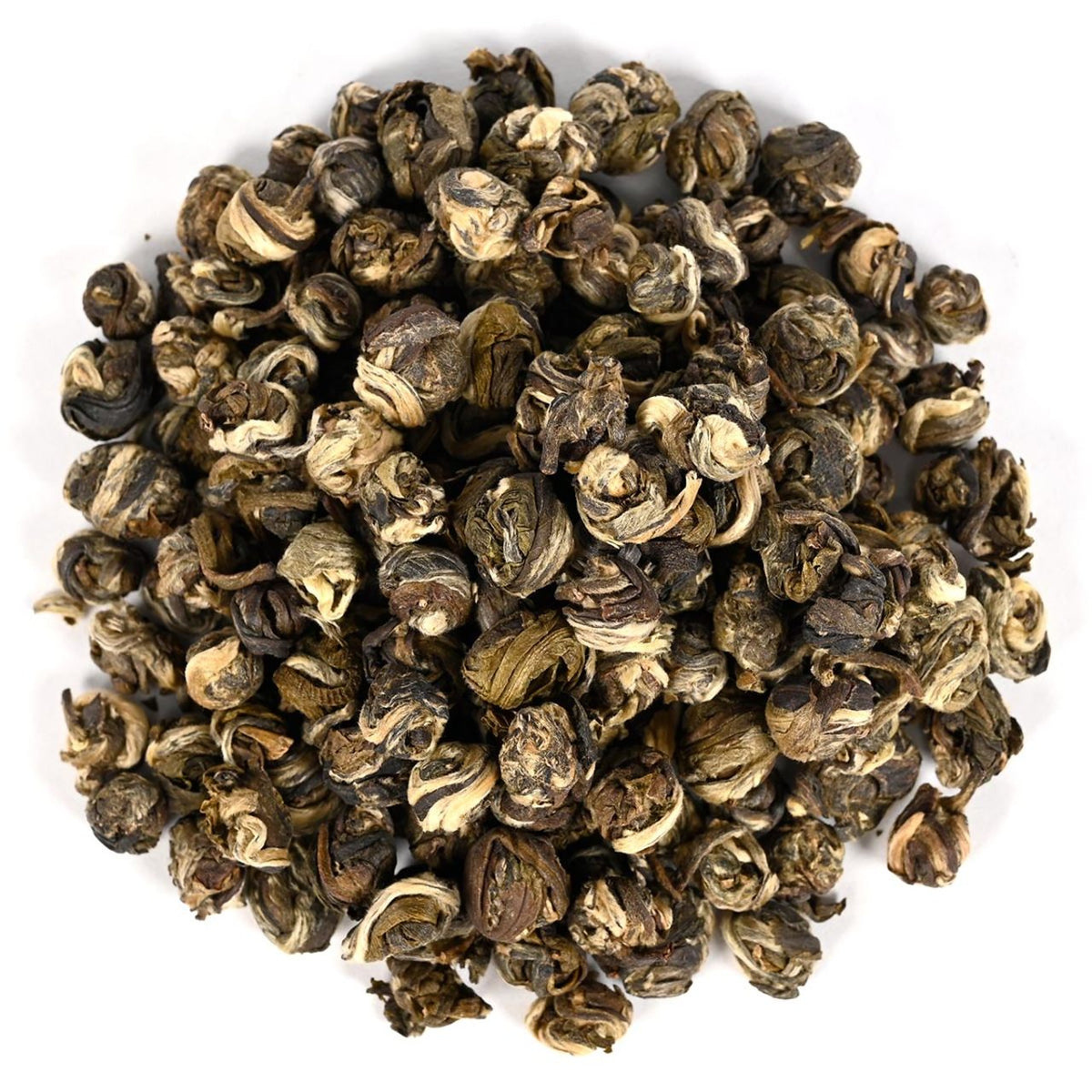 Close-up of dried tea leaves in round pearl shapes on a white background