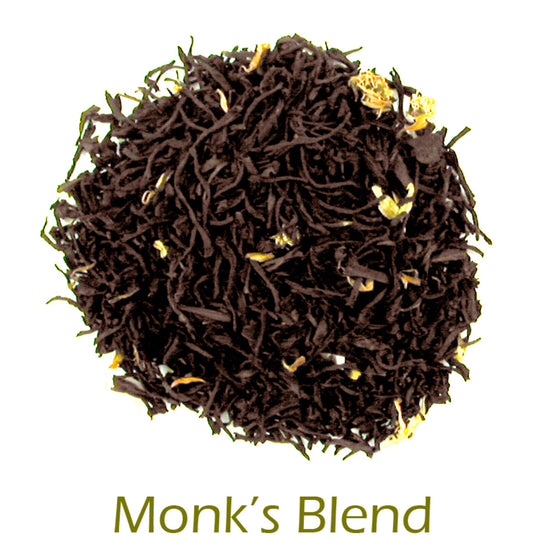 Monk's Blend black tea leaves on a white background