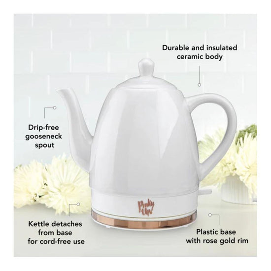 White electric kettle with rose gold accents on a white background