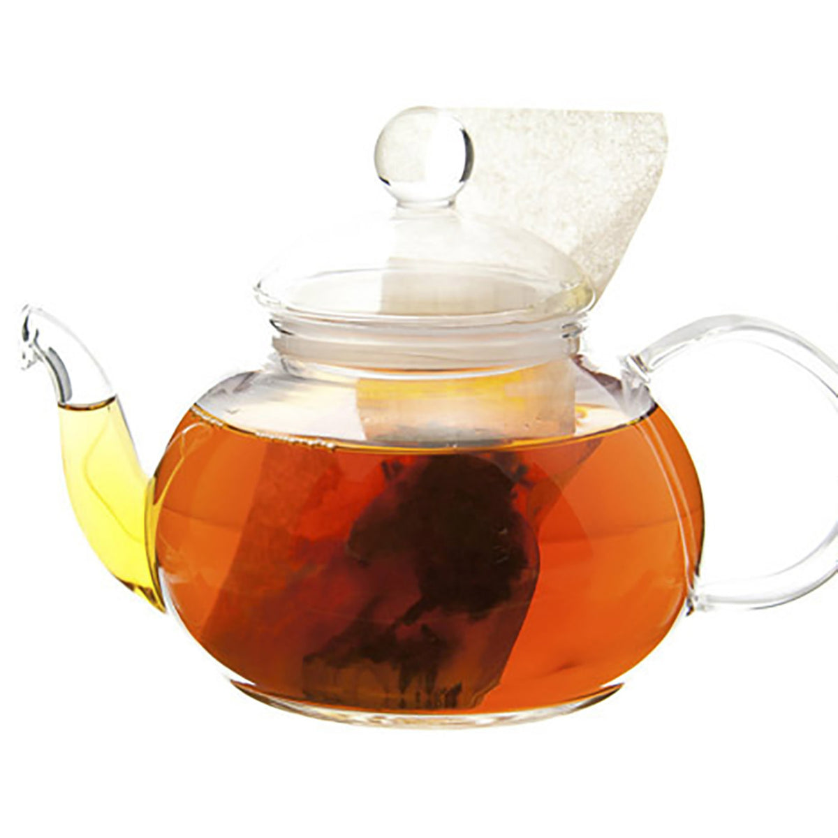 Clear glass teapot with a lid filled with tea on a white background