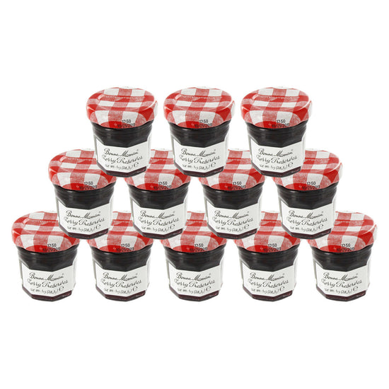 12 jars of Bonne Maman Cherry Preserves with a red and white checkered lid on a white background