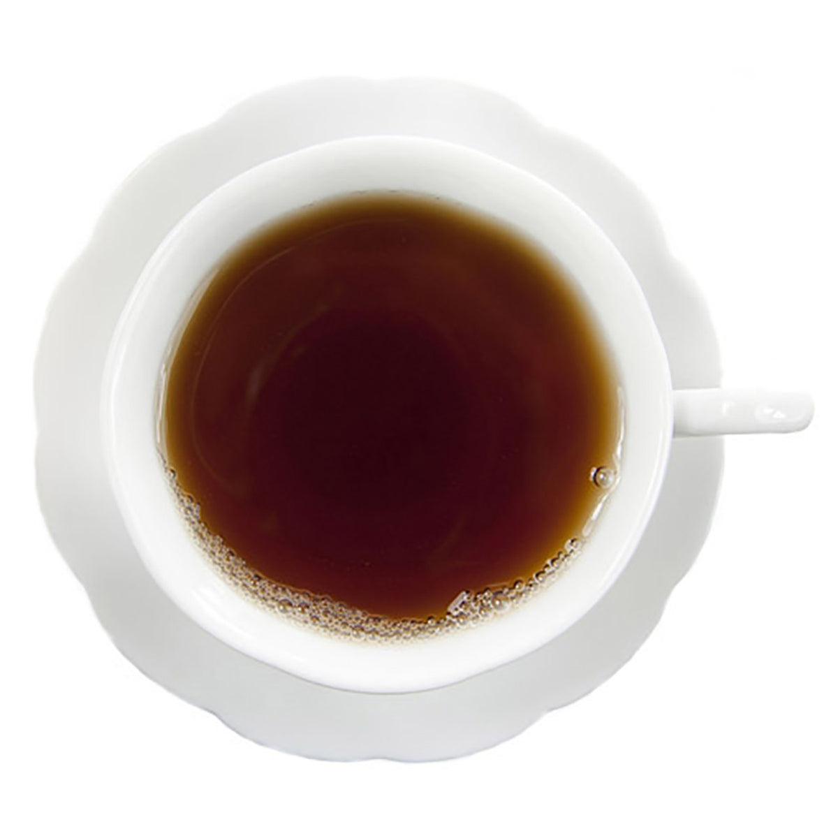 Top-down view of hot black tea in a white teacup on a white background