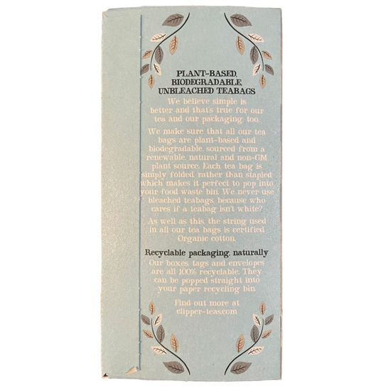 Tea bag packaging with plant-based, biodegradable, and unbleached tea bags on a light blue background.
