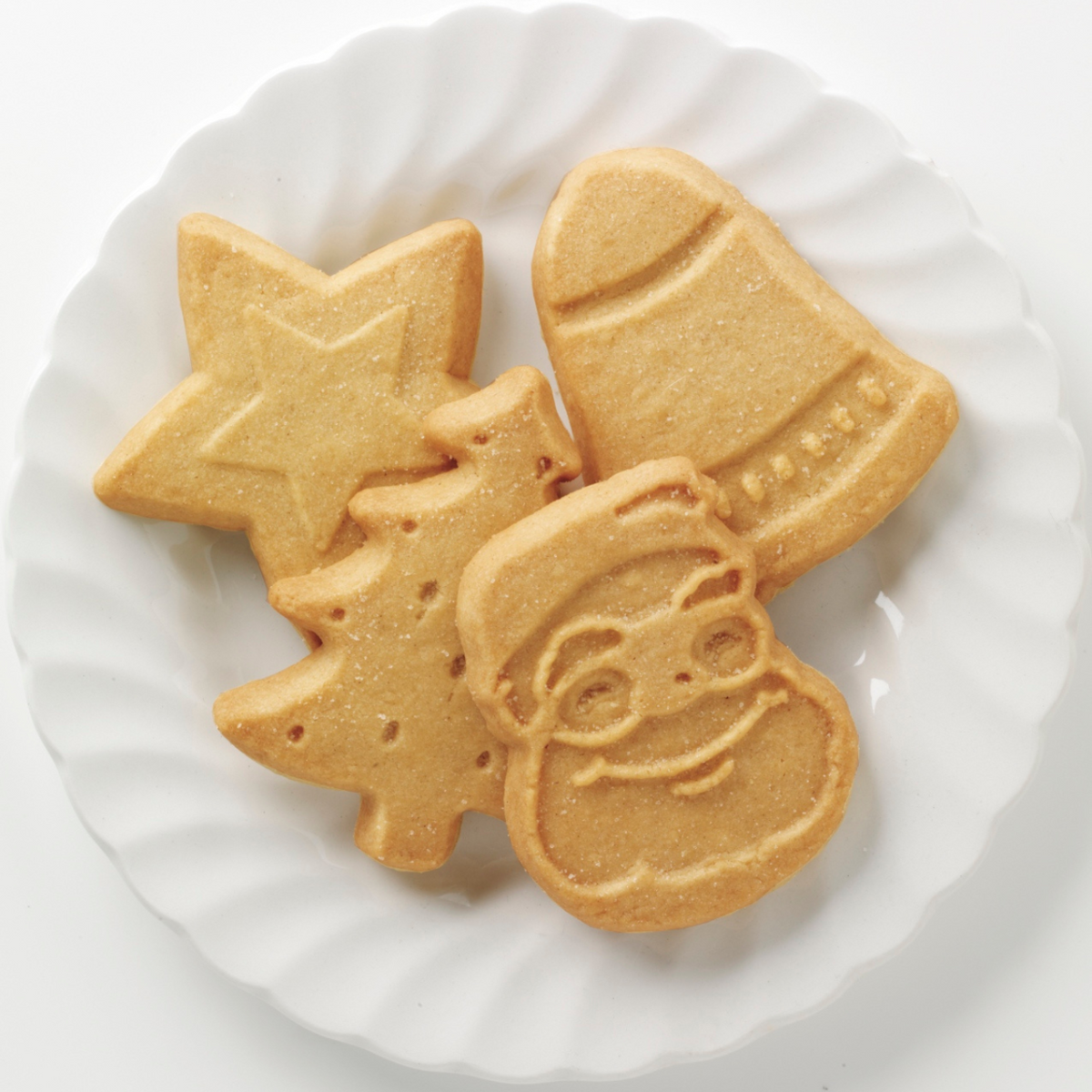 Walkers shortbread festive shapes on a white plate.
