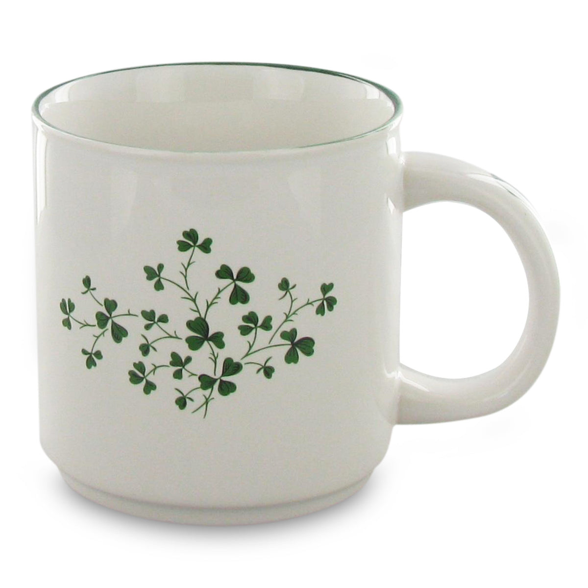 White mug with green shamrock design on a white background