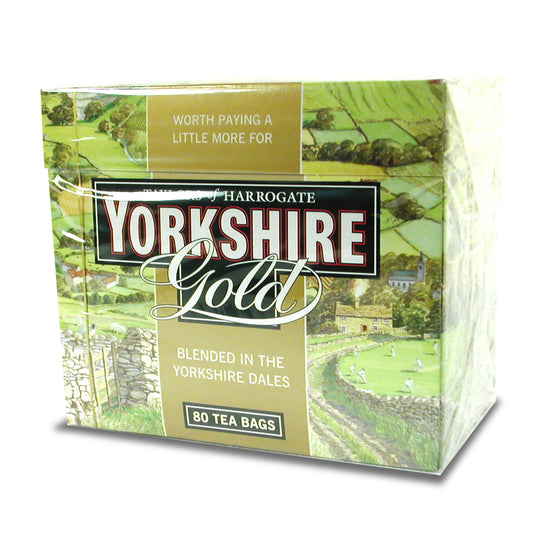 A box of Taylors of Harrogate Yorkshire Gold featuring a scenic view of the countryside and branding on a white background