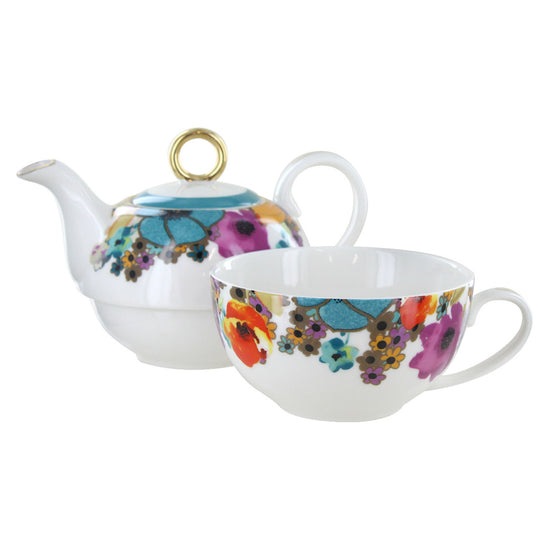 Teapot and teacup set with floral design on a white background