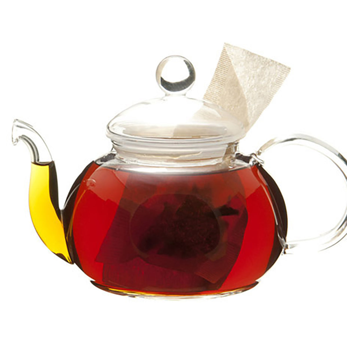 Glass teapot with dark amber tea and a teabag