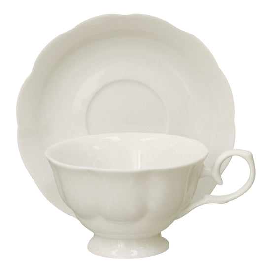 White porcelain teacup and saucer set on a white background