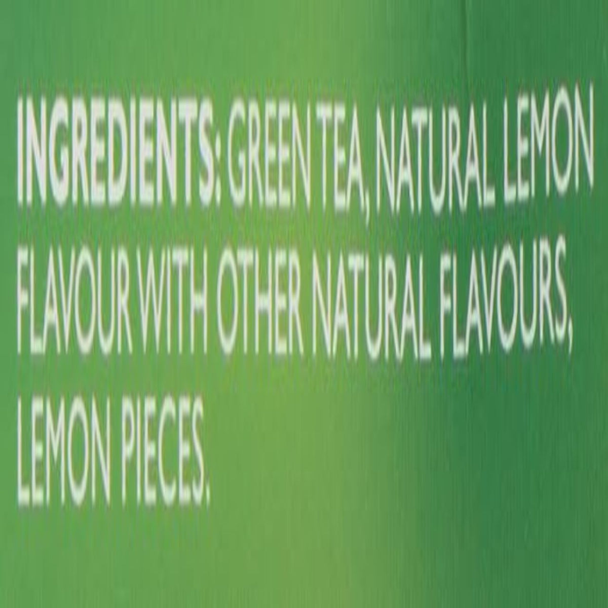 Text on a green background listing ingredients of a green tea product with lemon flavor.