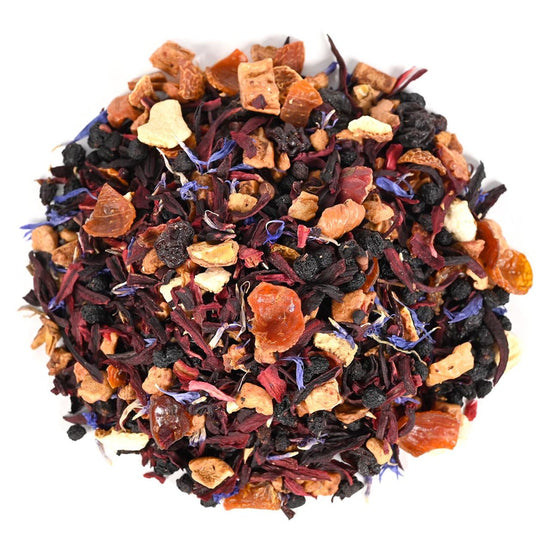 Assorted dried tea leaves, fruit pieces, and blue flower petals on a white background