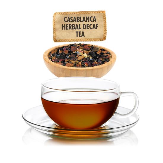 Glass cup of tea with a bowl of tea leaves and a label above on a white background