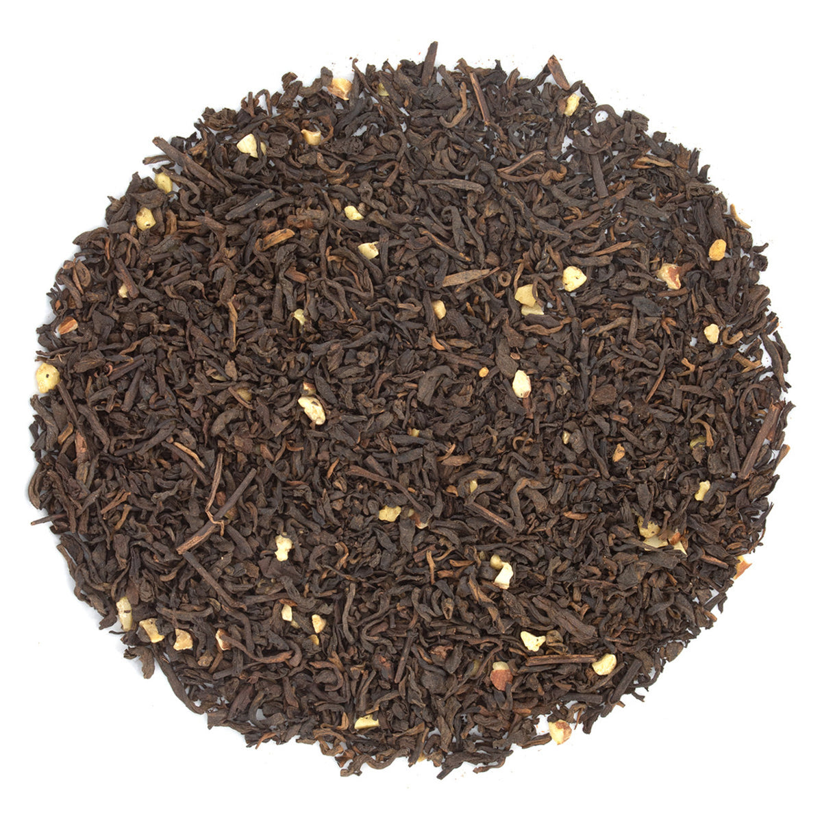Close-up of black tea leaves on a white background