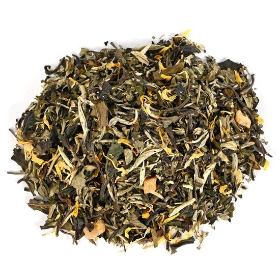 Dry tea leaves on a white background