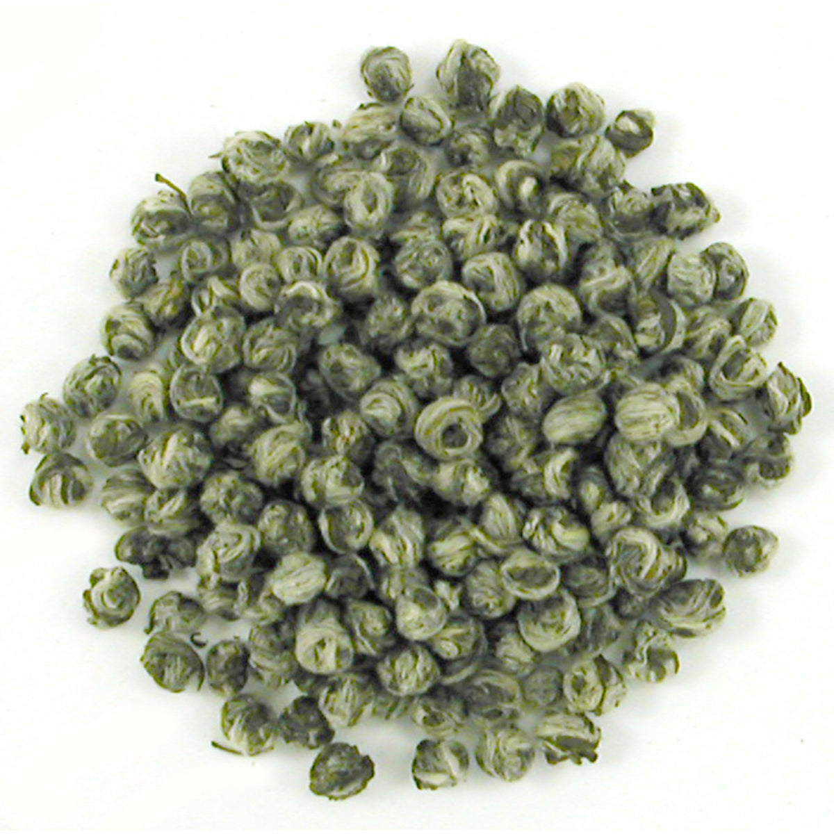 Close-up of green tea pearl shaped leaves on a white background