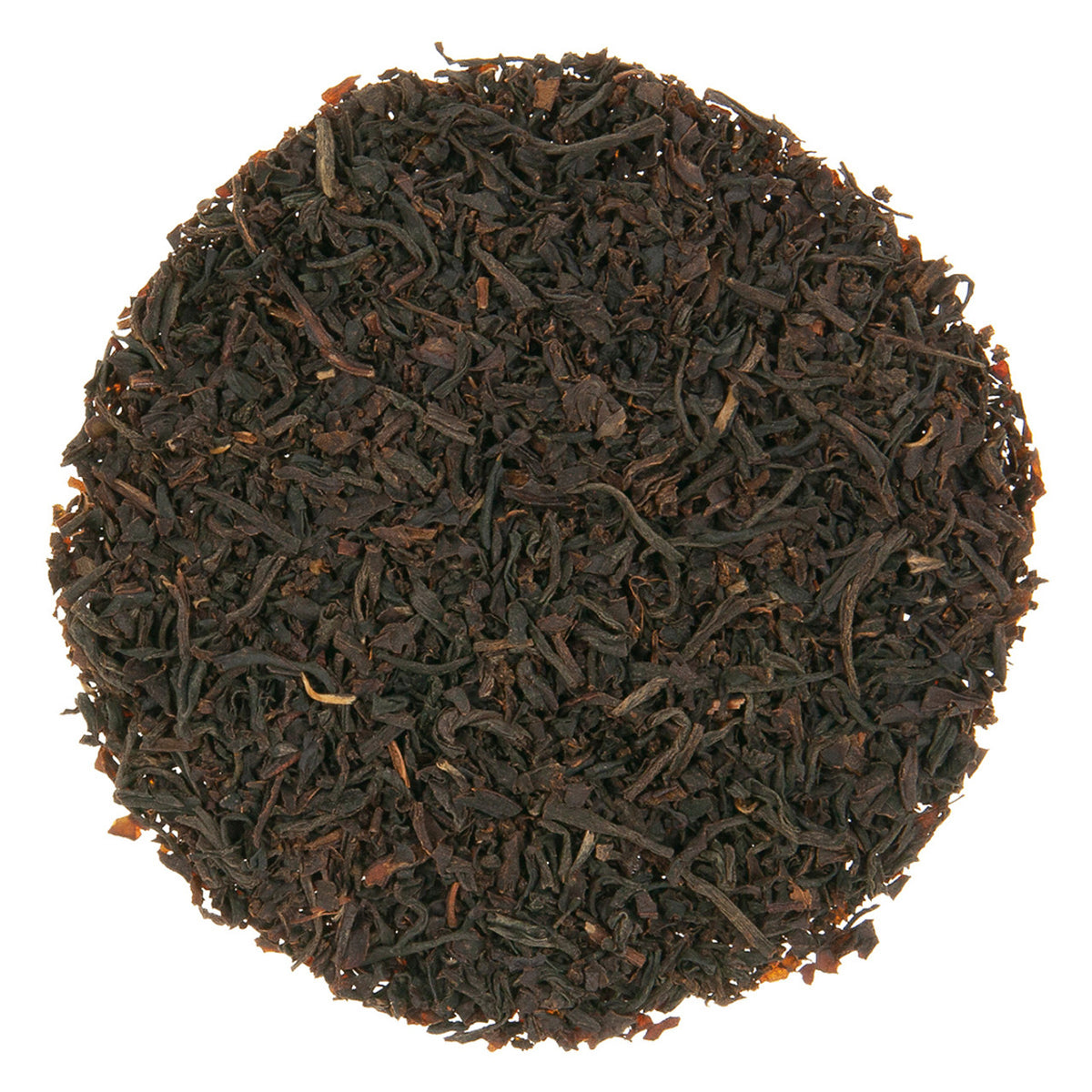 Close-up of dark brown tea leaves on a white background