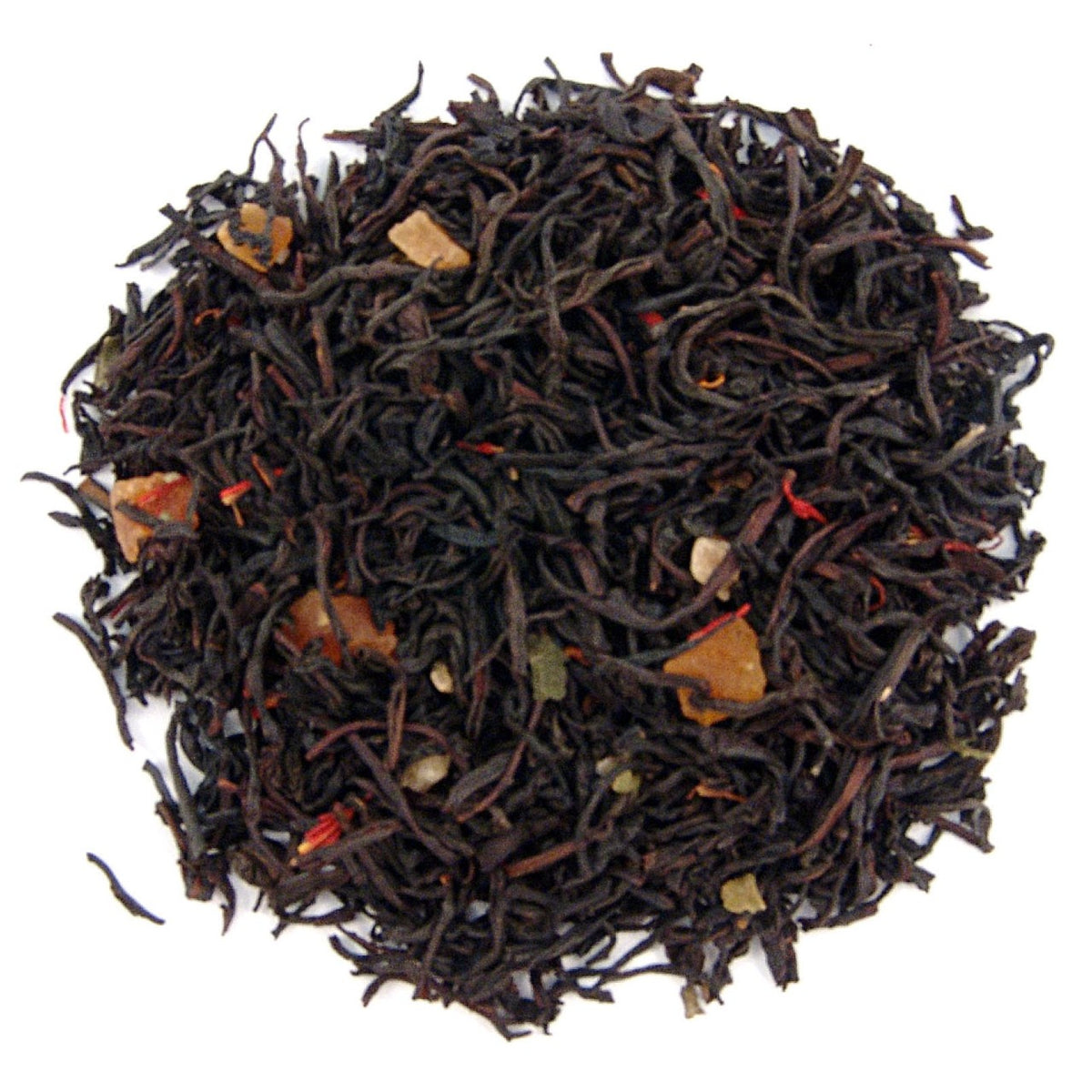 Close-up of black tea leaves on a white background
