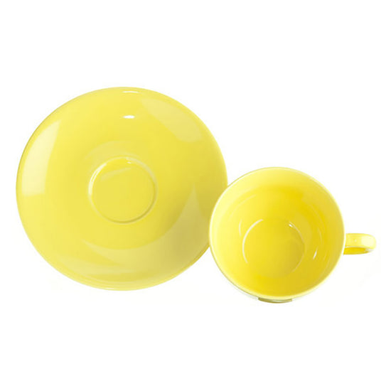 Yellow ceramic teacup and saucer on a white background