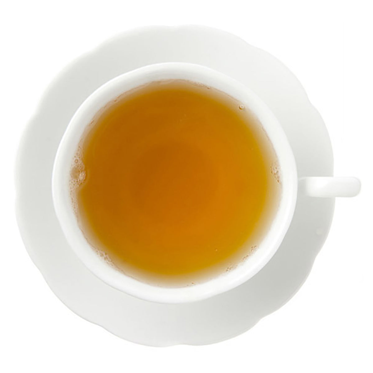 Hot yellow colored tea in white cup on white background