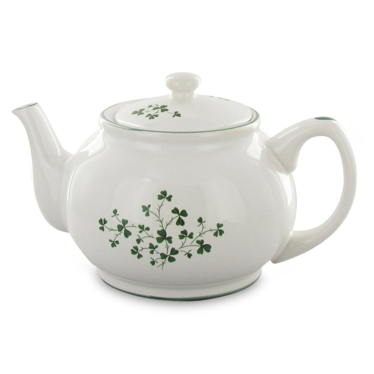 White teapot with green floral design on a white background