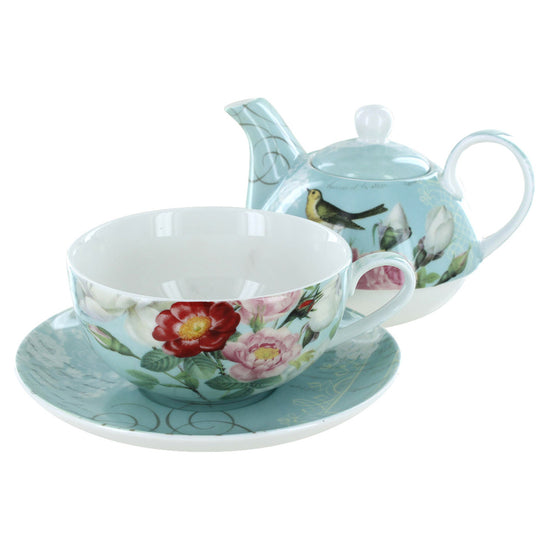 Porcelain tea set with floral cup, saucer, and teapot on a white background