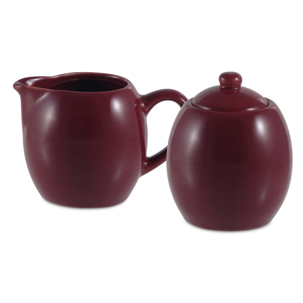Burgundy ceramic creamer and sugar set on a white background