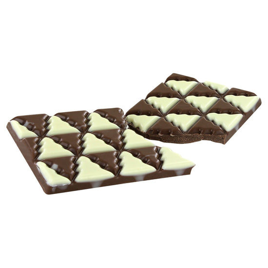 Cadbury Dairy Milk Winter Wonderland Edition chocolate bar with milk chocolate and white chocolate Christmas shaped pieces.