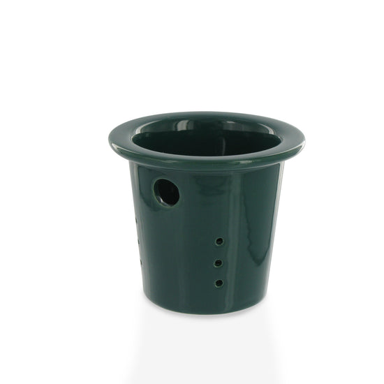 Green teapot infuser insert on a white background
