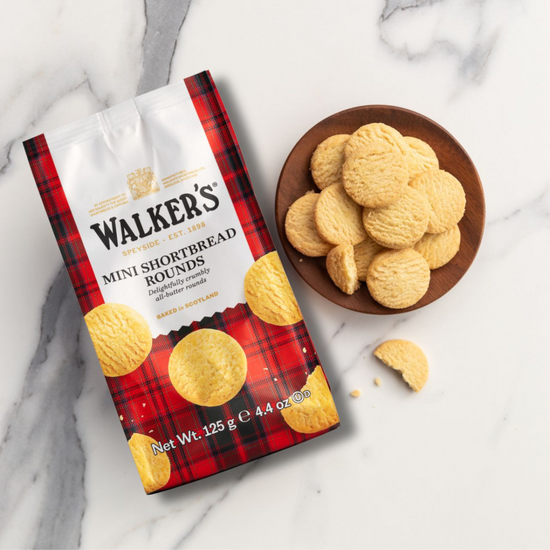 Walker's Mini Shortbread Rounds packaging with cookies on a marble surface
