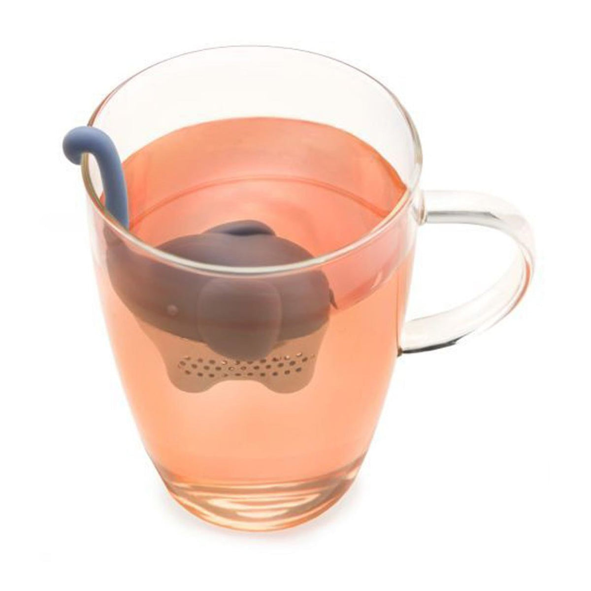 Blue elephant shaped tea infuser in a glass mug of pink colored tea.