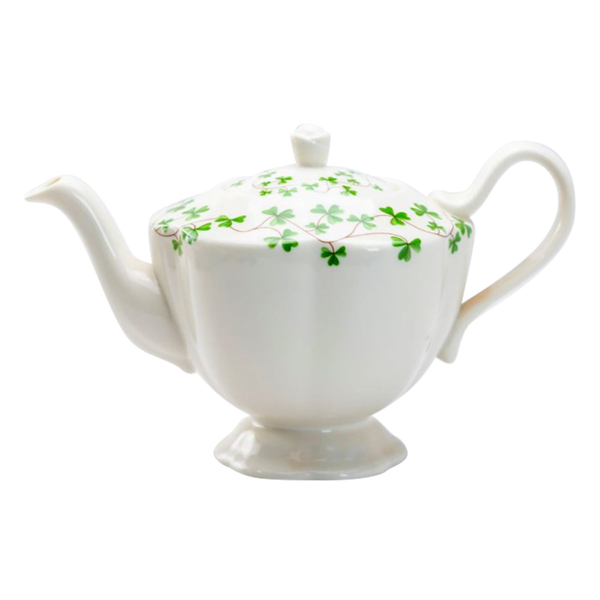 White teapot with green leaf pattern on a white background