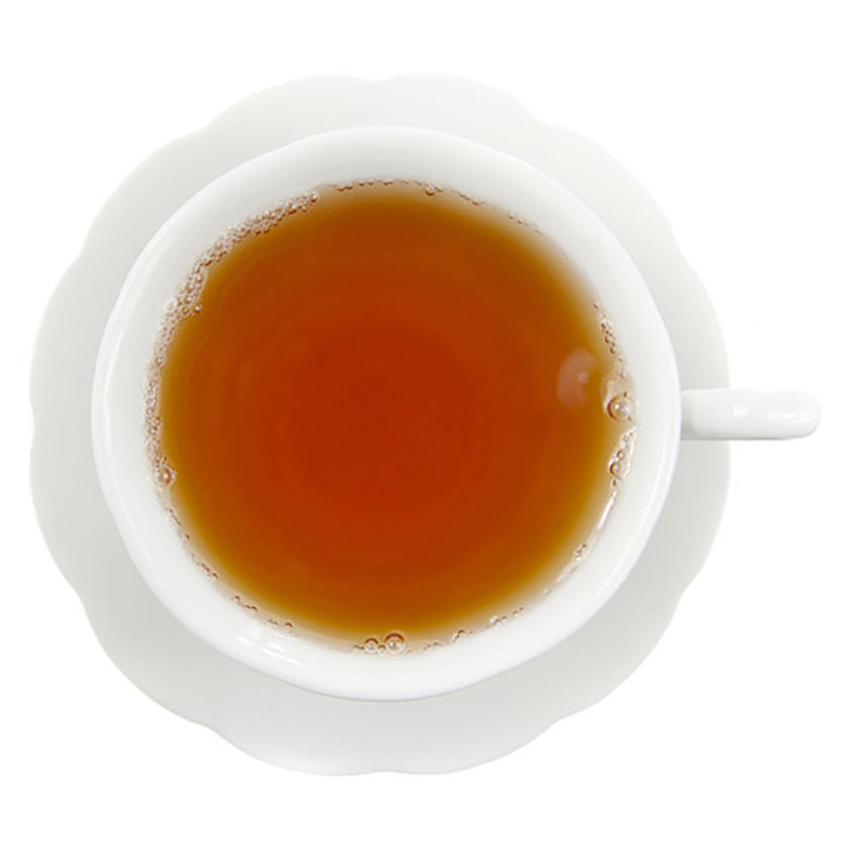 Light amber colored hot tea in white cup on white background