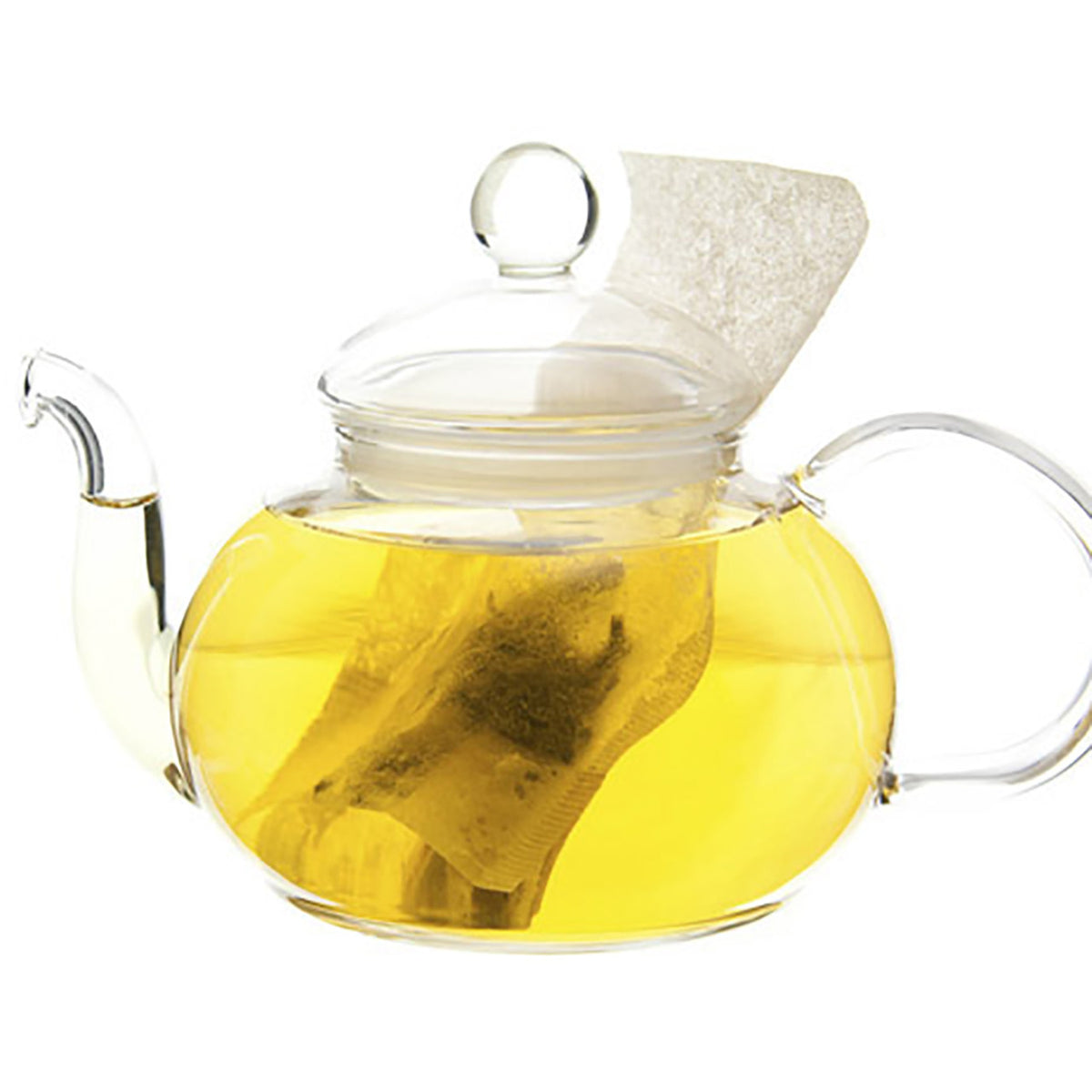 Glass teapot with hot yellow colored tea with a teabag on a white background