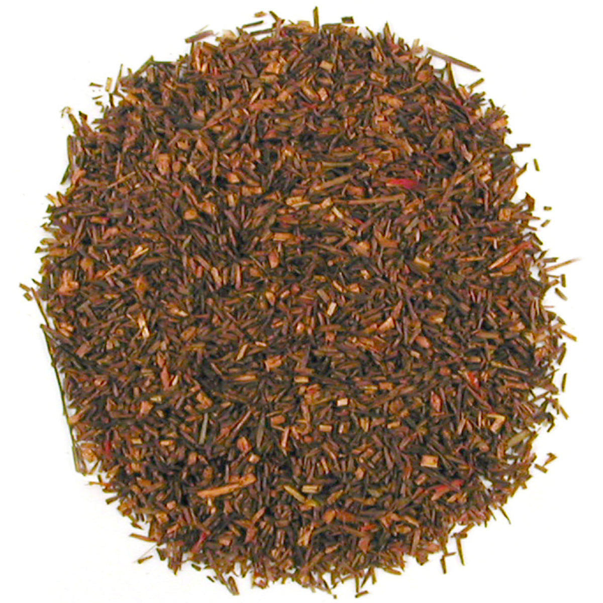 Close-up of dried rooibos tea leaves on a white background