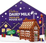 Cadbury Dairy Milk Chocolate House Kit. The purple house-shaped box displays a festive snowy scene and a model of the completed build-it-yourself chocolate house.