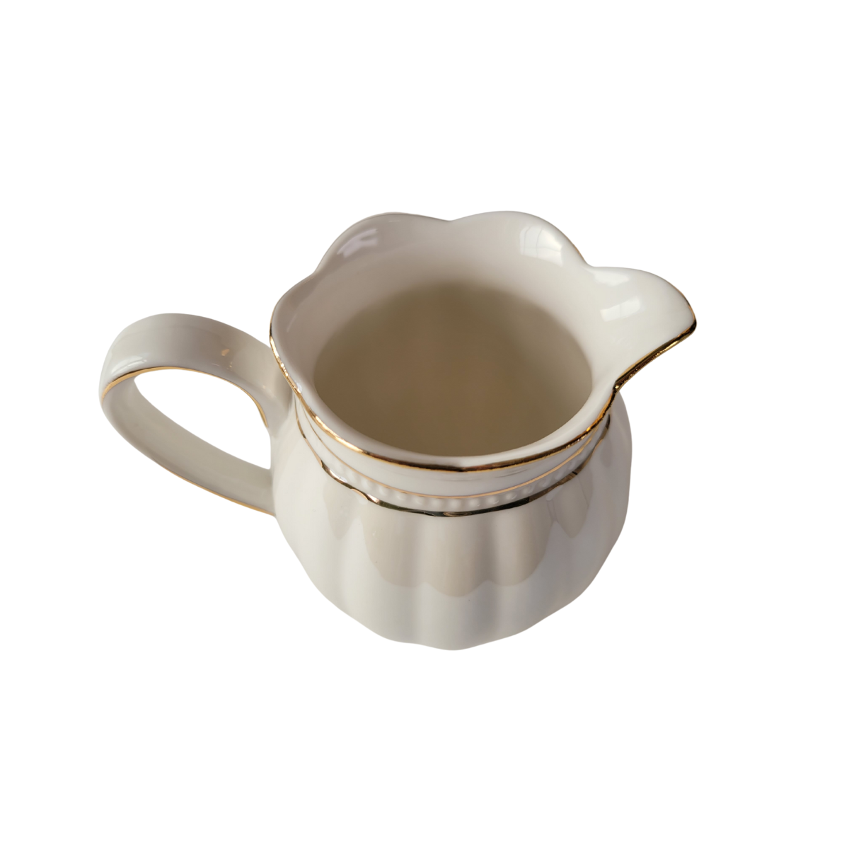 Luster Gold Porcelain gold trimmed creamer on a white background