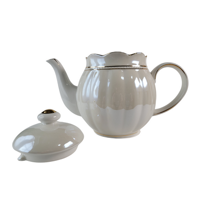 Luster Gold Porcelain gold trimmed teapot with lid off and on the side on a white background