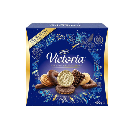 McVitie's Victoria Assortment Biscuit Selection box. The dark blue and gold festive packaging displays a central cluster of assorted chocolate-covered biscuits.