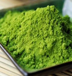Vibrant green Matcha powder in a container