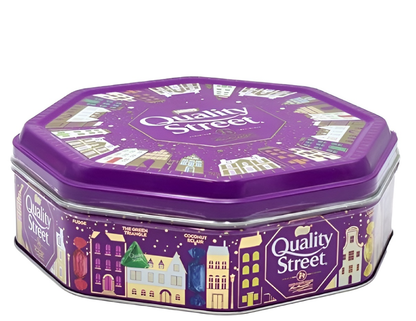 Hexagonal purple Quality Street tin with colorful illustrations on a white background