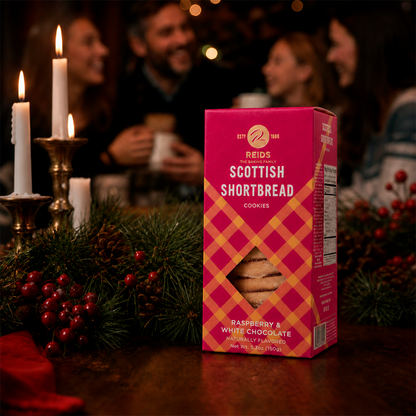 Pink and red patterned product box on a table with people gathered in a holiday setting