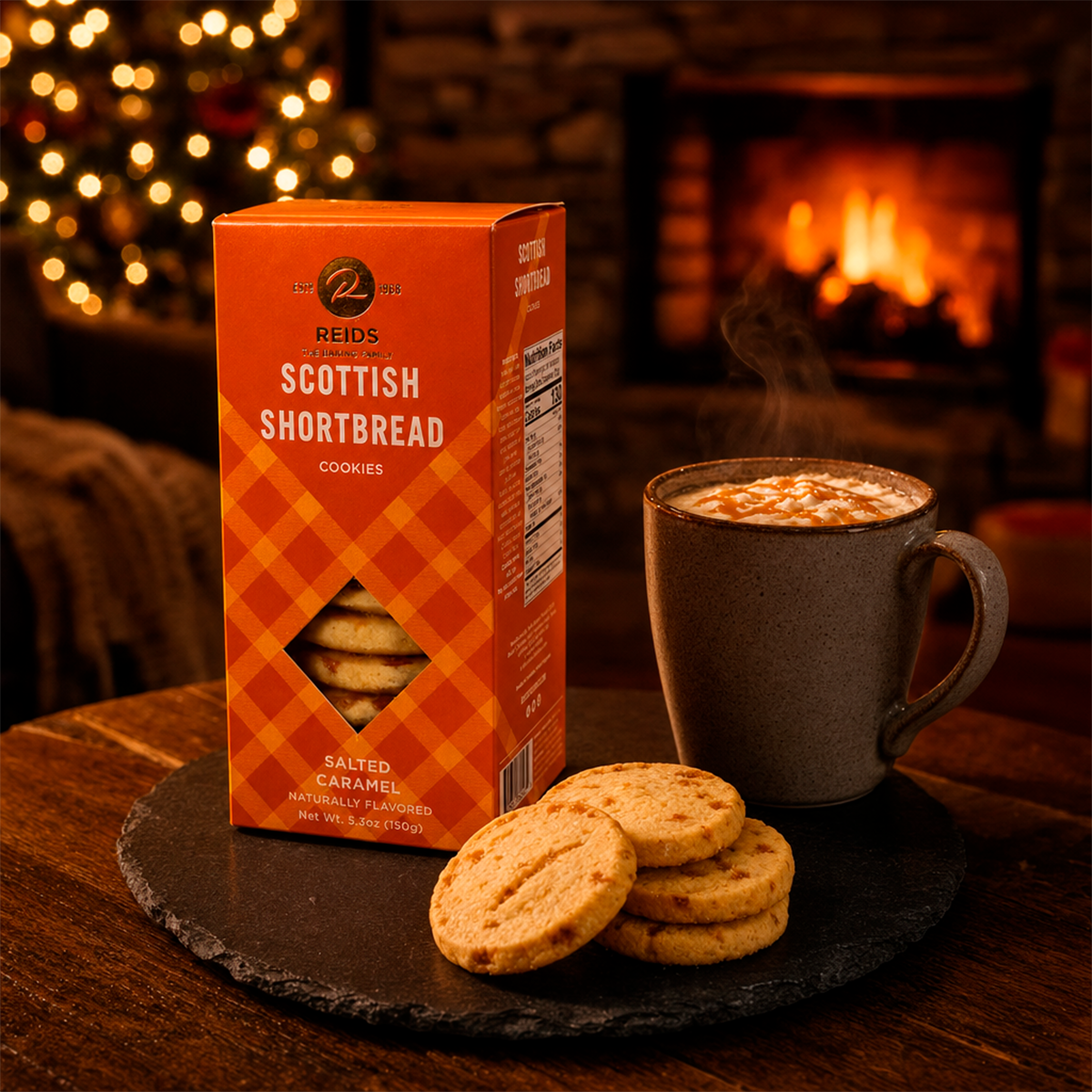 Product box, mug, and scones on a dark plate in front of a fireplace.