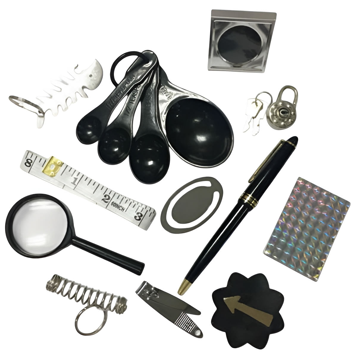 Collection of various items including measuring spoons, a pen, a magnifying glass, and a lock on a white background.
