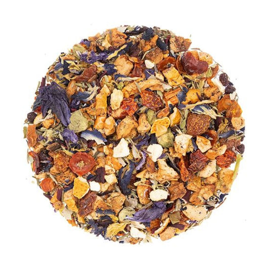 An circle of herbal tisane tea leaves with dried fruit pieces of various colors.