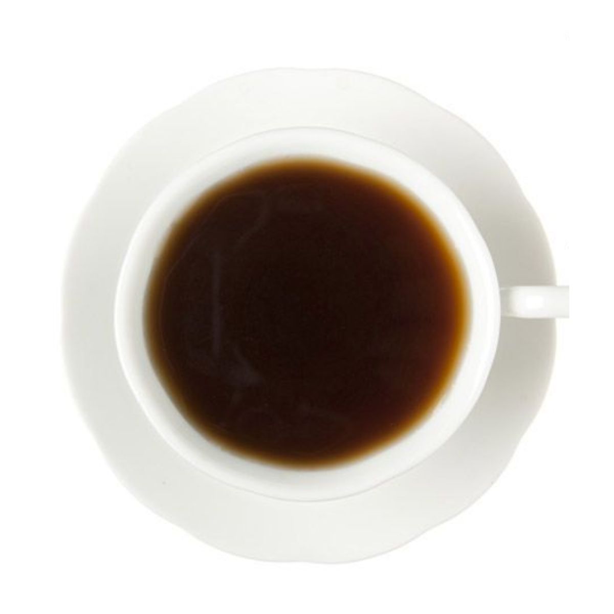Dark hot black tea in a white teacup and on a white saucer all on a white background